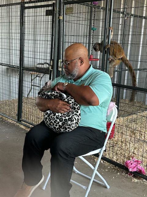 Old man holding kangaroo