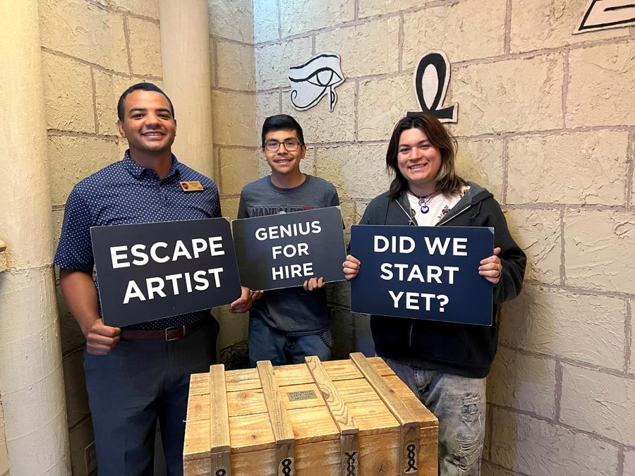 Group of friends holding a card