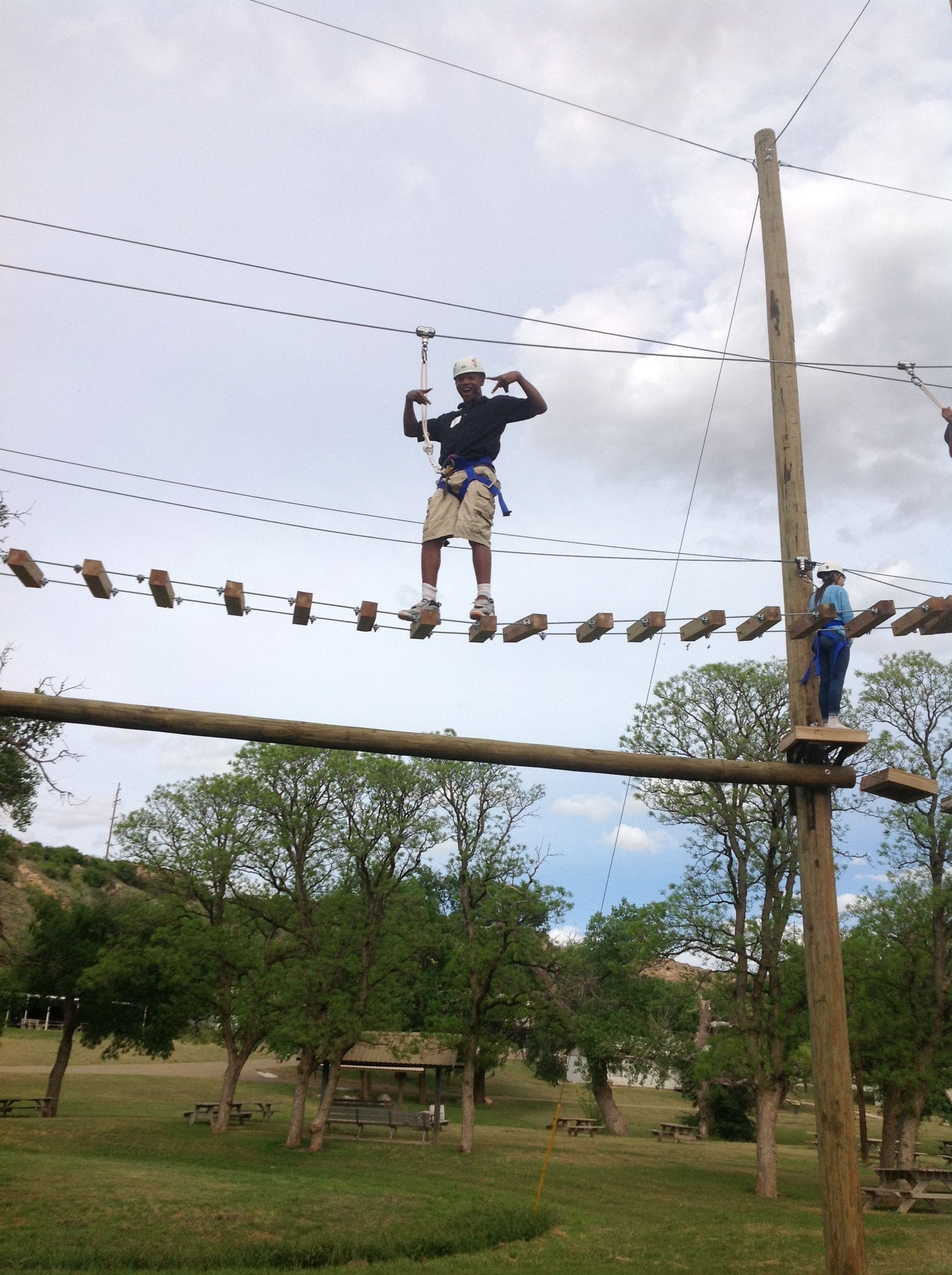 Man Walking On The Hanging Ladder